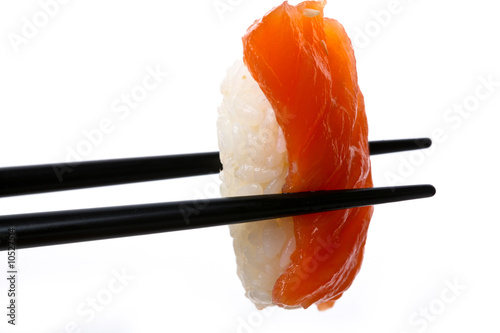 Stock Photo: Sushi with chopsticks shot on white