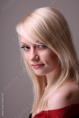 Beautiful blond fashion model posing in studio