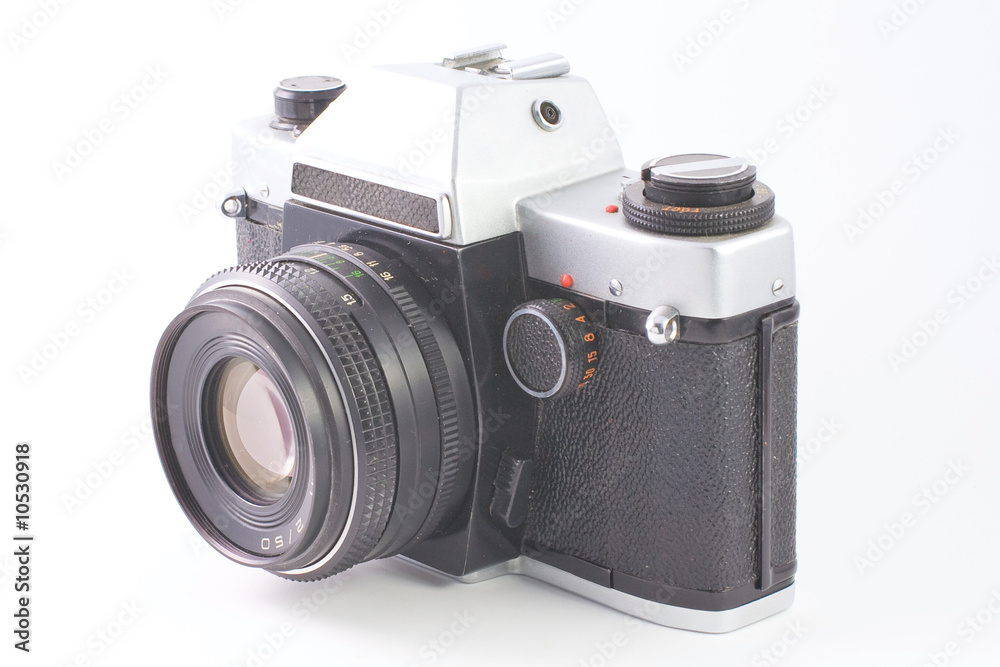 Old SLR camera isolated on white background
