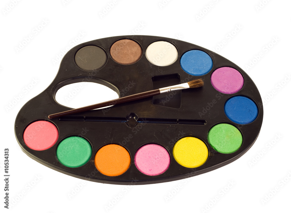 A painters palette and brush isolated on a white background A painters palette and brush isolated on a white background