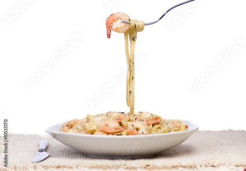 A plate of fresh shrimp fettuccine pasta.
