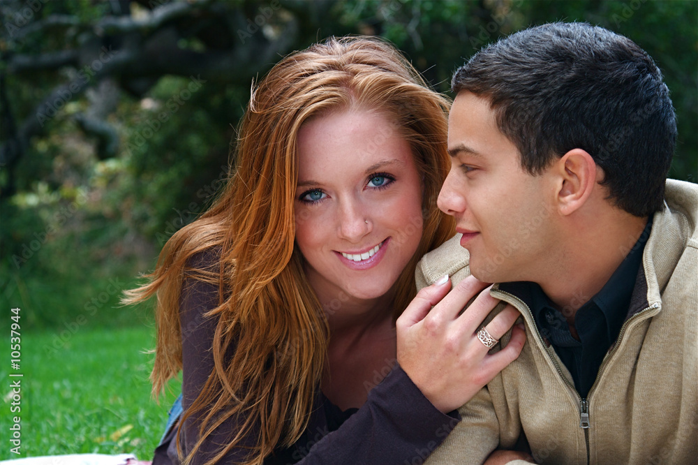 Young couple in an autumn forest picnic area