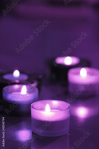 five burning candles on the table (purple)