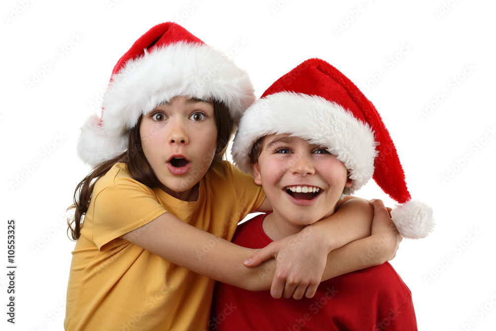 Kids wearing Santa Claus hats isolated on white background Kids wearing Santa Claus hats isolated on white background