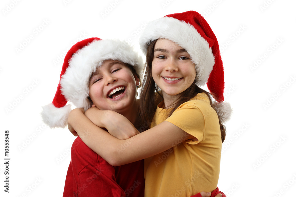 Kids wearing Santa Claus hats isolated on white background Kids wearing Santa Claus hats isolated on white background