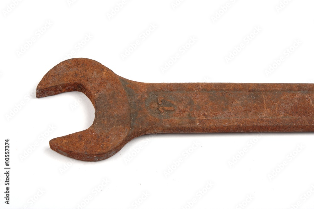 Old rusty spanner isolated on white background. Old rusty spanner isolated on white background.