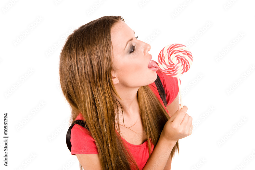 Provocative woman licking colorful lollipop.