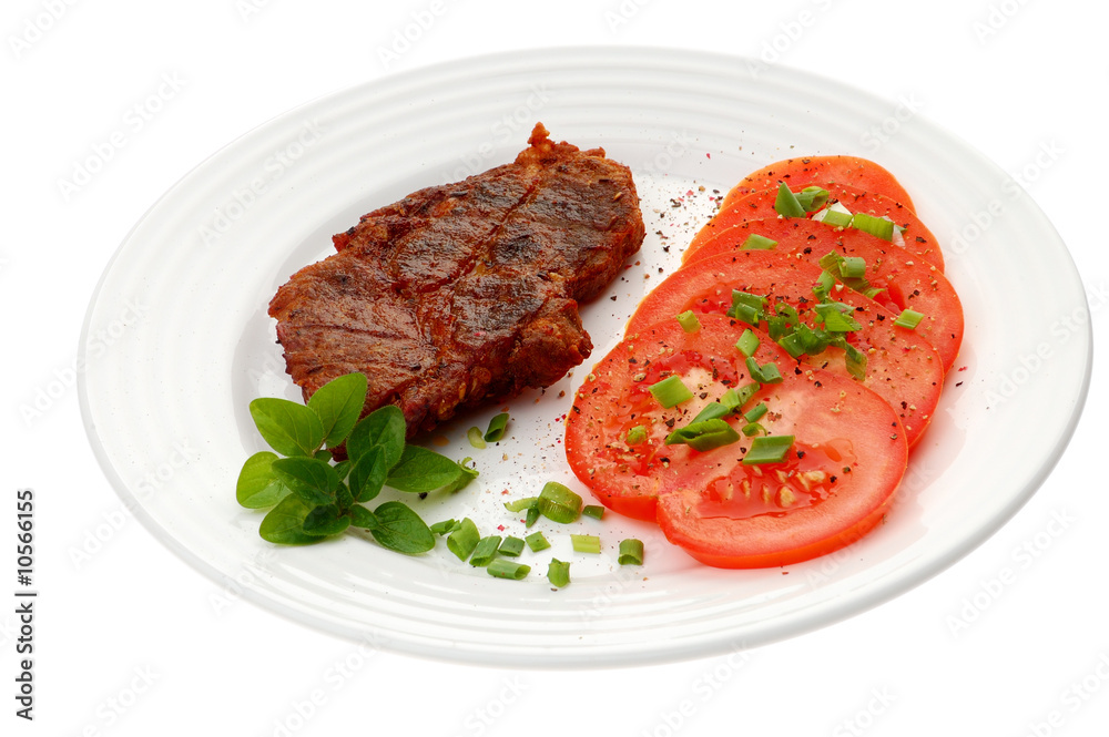 Grilled steak with vegetable salad isolated on white Grilled steak with vegetable salad isolated on white