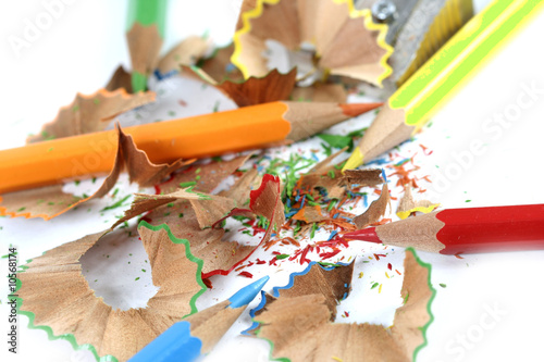 Sharpened pencil and wood shavings.