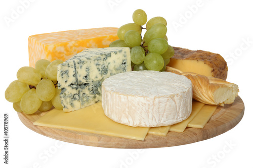 Cheese and grapes on wooden platter