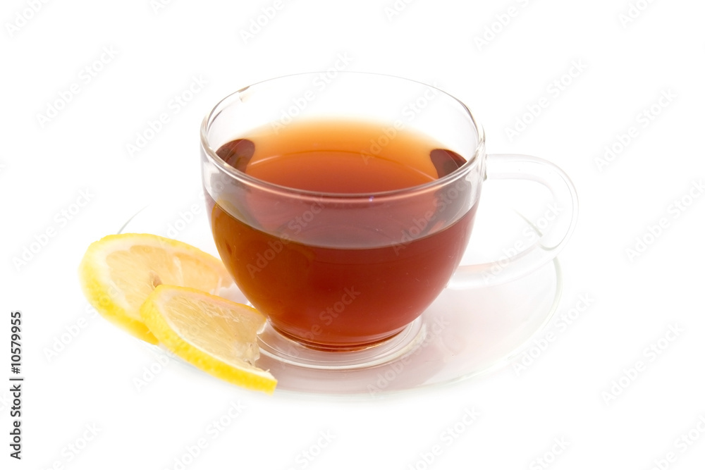 Transparent teacup with tea and lemon