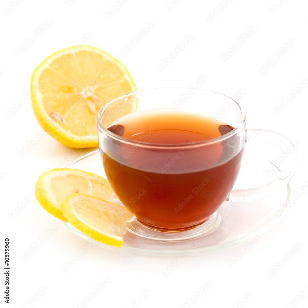 Transparent teacup with tea and lemon