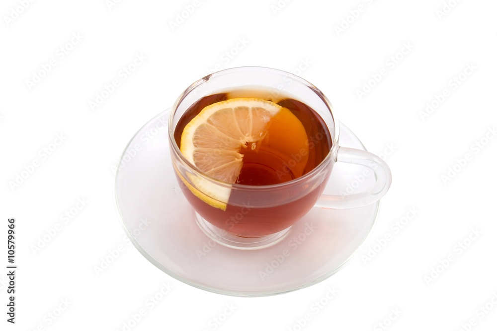 Transparent teacup with tea and lemon Transparent teacup with tea and lemon