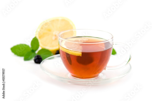 Transparent teacup with tea isolated