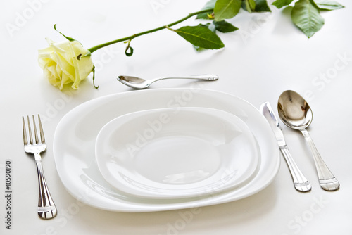 place setting with rose flower