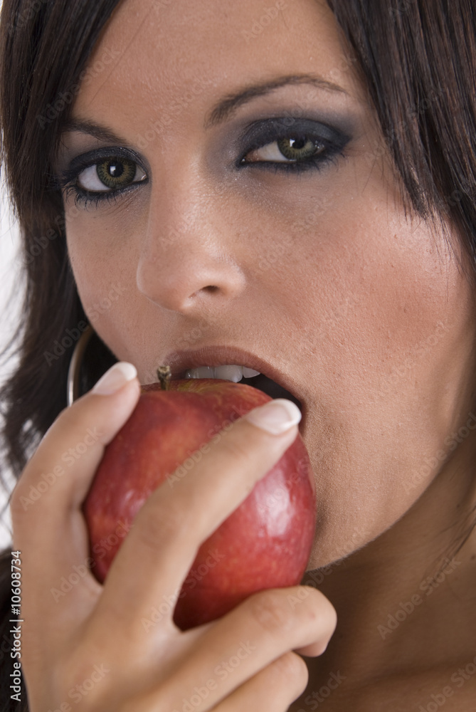 sexy woman with beautiful eyes eating an apple sexy woman with beautiful eyes eating an apple