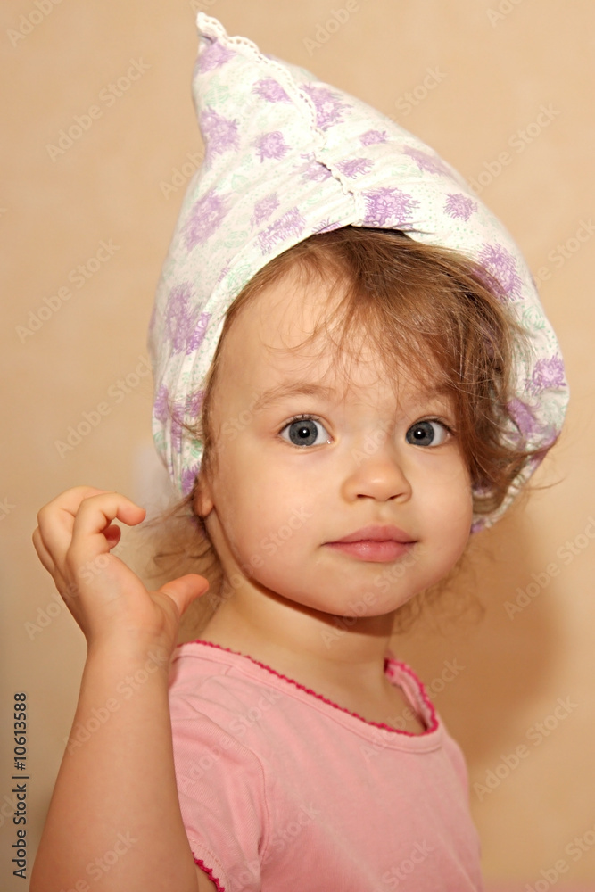Little girl with a pillow on a head. Little girl with a pillow on a head.