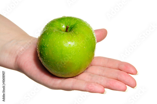 Woman hand holding fresh green apple