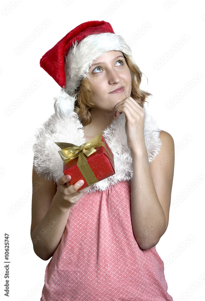 Girl in a santa clause cap with present Girl in a santa clause cap with present