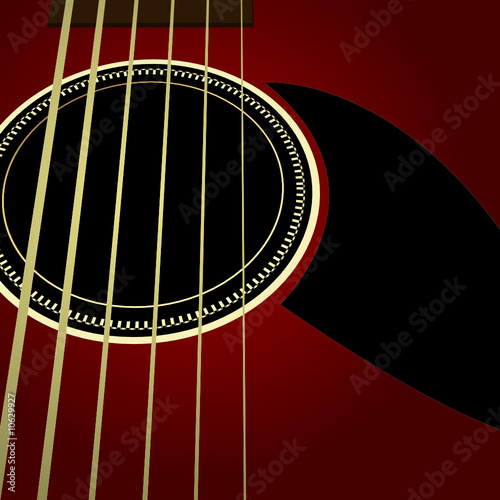 Dark acoustic guitar close up
