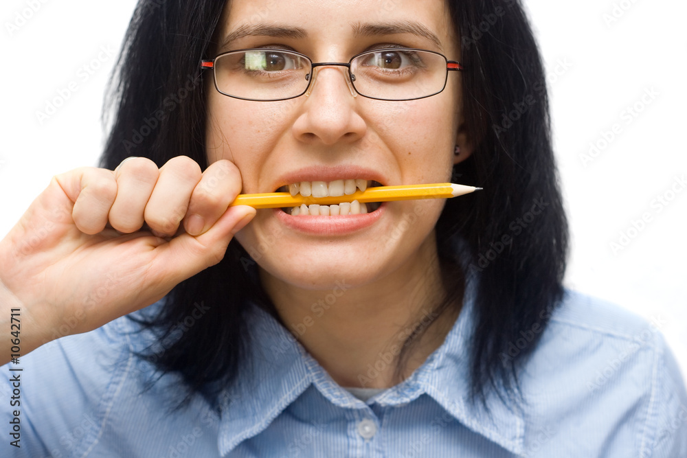 angry woman wearing glasses biting a pencil angry woman wearing glasses biting a pencil