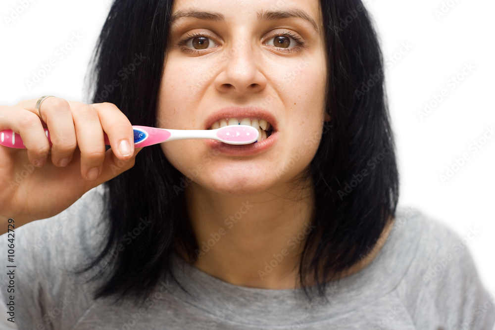 caucasian woman brushing teeth isolated on white caucasian woman brushing teeth isolated on white