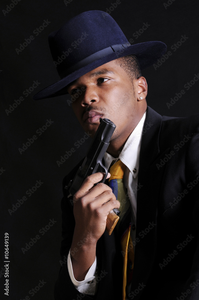 young African American man with gun young African American man with gun