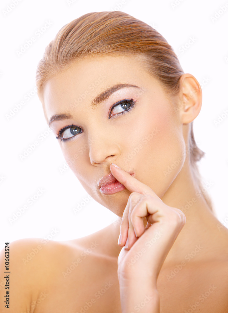 Portrait of beautiful blond woman with finger on mouth Portrait of beautiful blond woman with finger on mouth