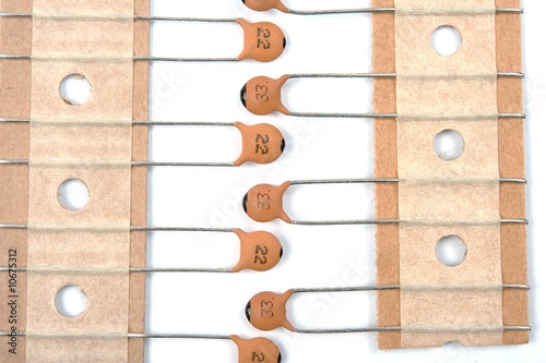 New ceramic capacitors on paper tape isolatet on white.