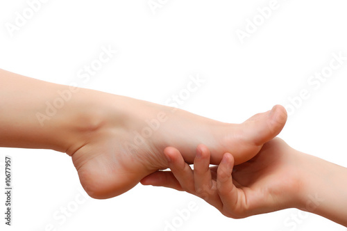 Man's hand and woman's feet