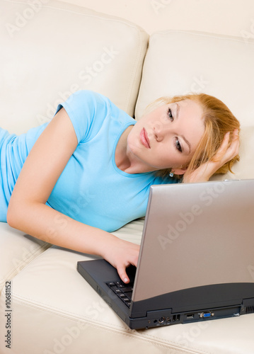 thoughtful woman with a laptop