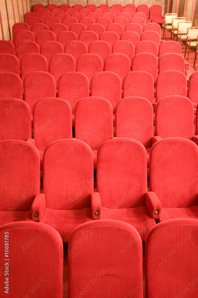 Fototapeta premium red chairs in the empty small cinema auditorium