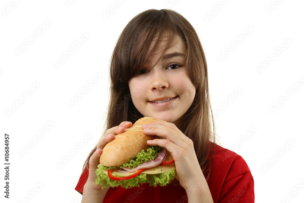 Girl eating healthy sandwich isolated on white background Girl eating healthy sandwich isolated on white background