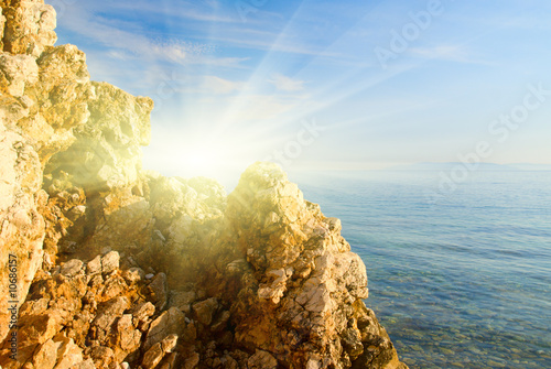 rock and blue water of Adriatic sea photo