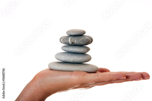 Hand with a pyramid of stones