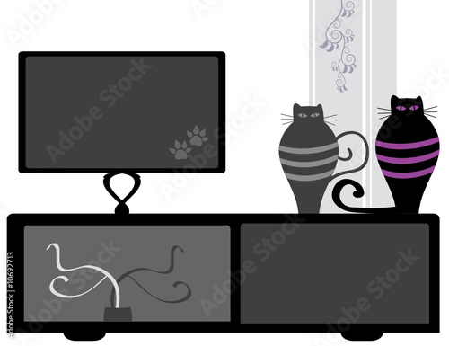 Modern TV stand decorated with whimsical cats figurines