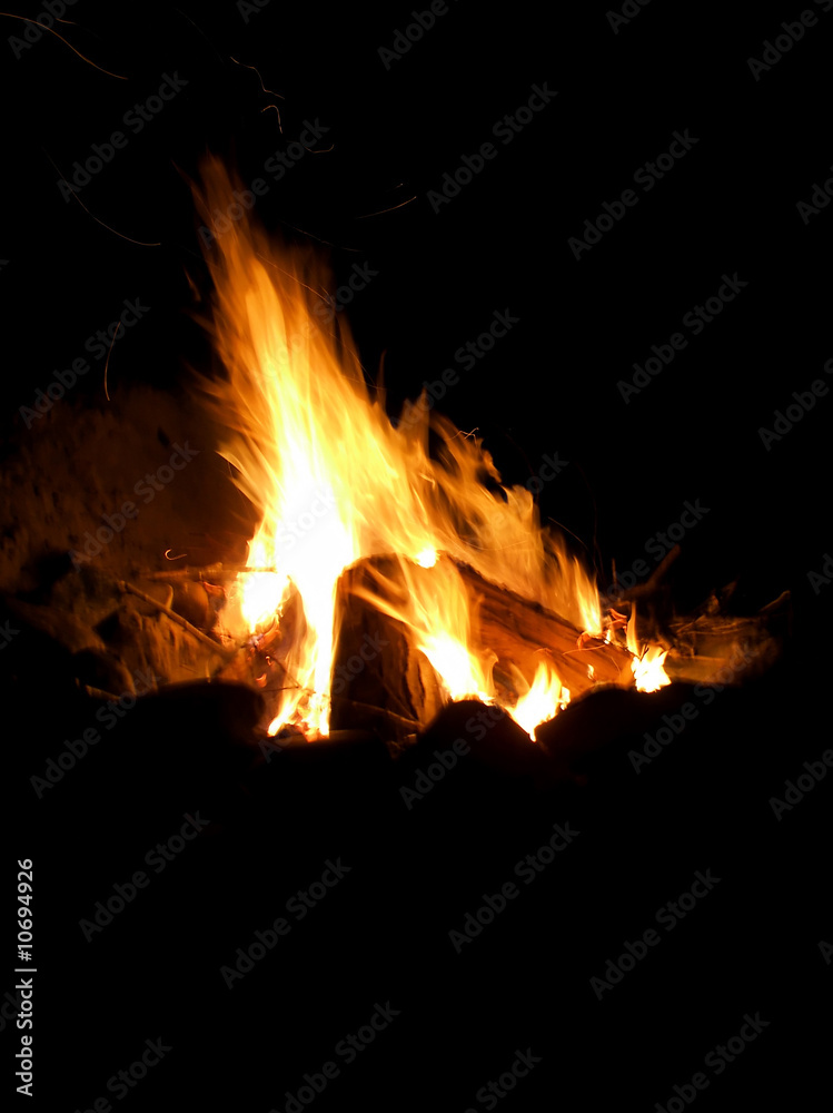 Closeup of camp fire or bonfire built in evening