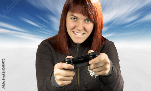 Cute redhead playing video games in winter