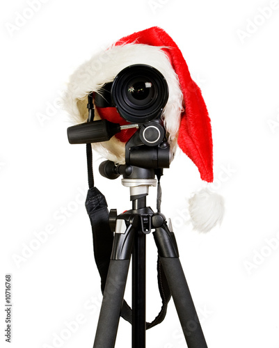 Digital photo camera in a santa clause cap