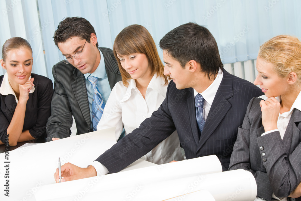 Successful business team working together at office Successful business team working together at office
