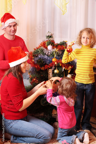 family with christmas fir