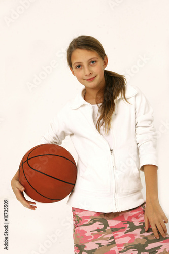 gir with basket ball in hands