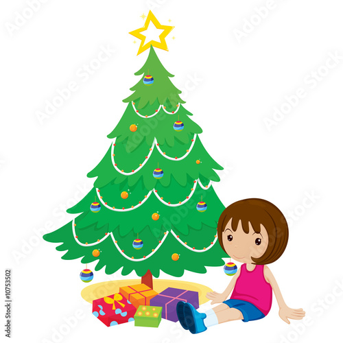girl sitting by the christmas tree waiting to open presents