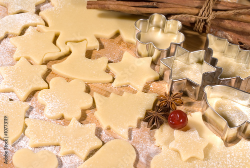 Dough and christmas cookie cutter forms photo