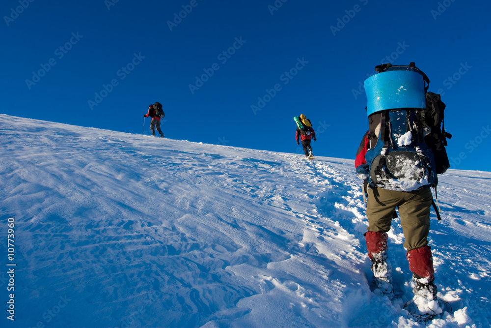 Hiker are in winter in mountains