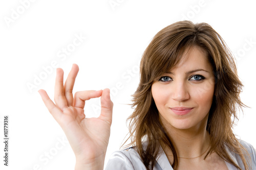 Young businesswoman indicating ok sign.