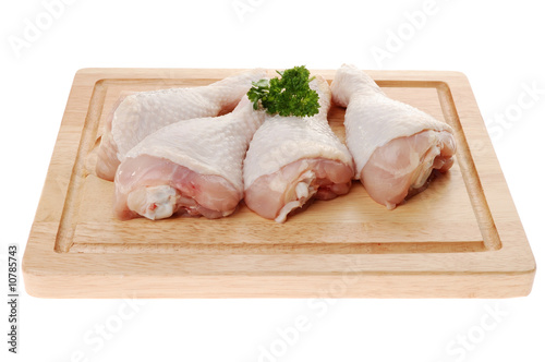 Raw chicken legs isolated on white background