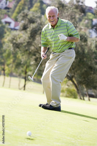 Man Playing A Game Of Golf