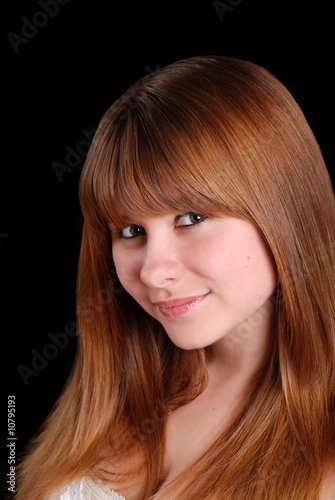young teen female on a black background
