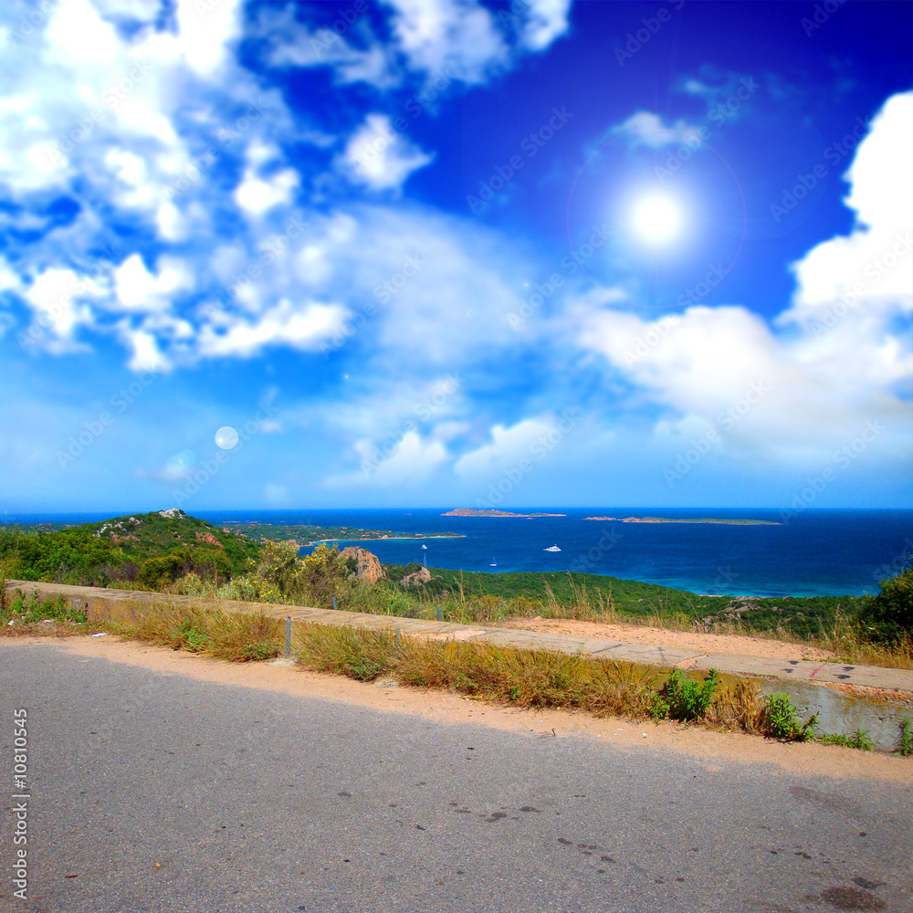 Sea landscape with cloudy sky and sun